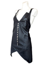 Dirbtinės odos prijuostė su skeltuku ir sagutėmis